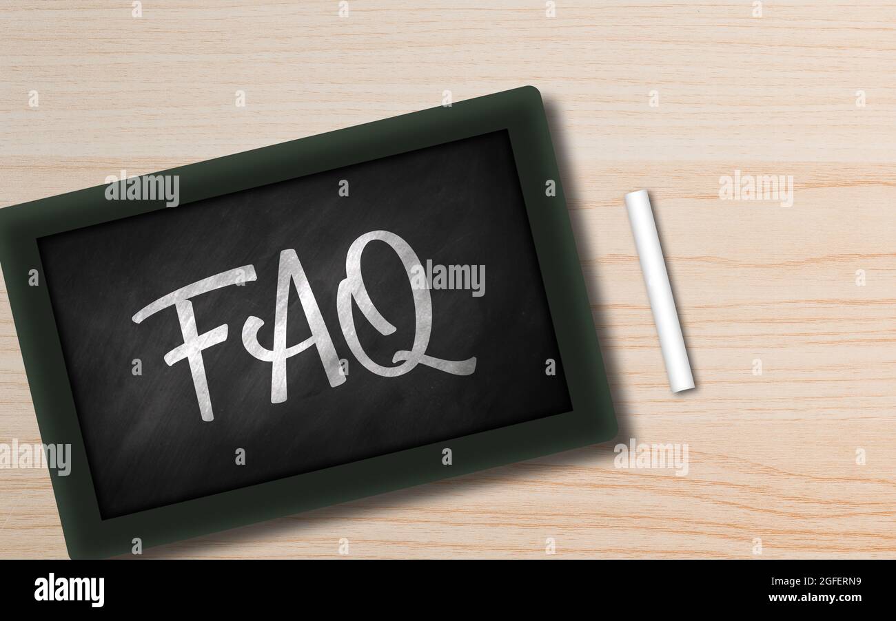 Frequently Asked question written n Small chalkboard. hand Written FAQ in blackboard on Wooden background with Copy space. Business help and support c Stock Photo