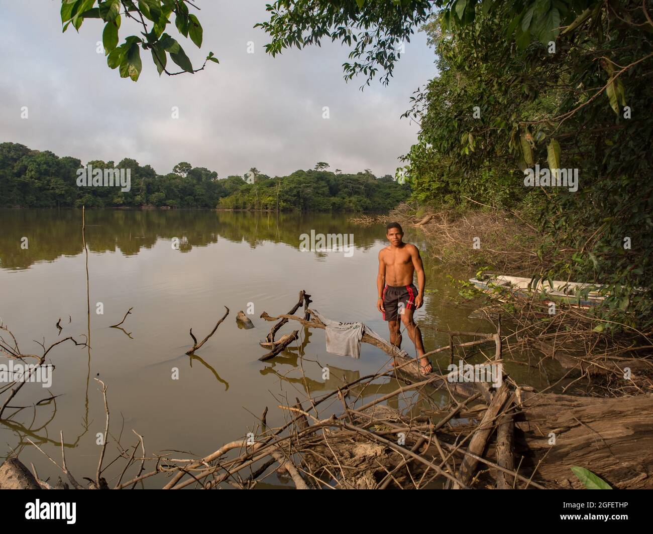 Amazon, Brazil - Sep 2017: Brazilian man on the bank of the lagoon in ...