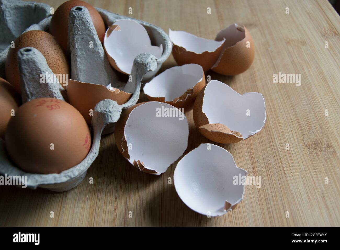 Brown speckled empty eggshells on the kitchen worktop Stock Photo