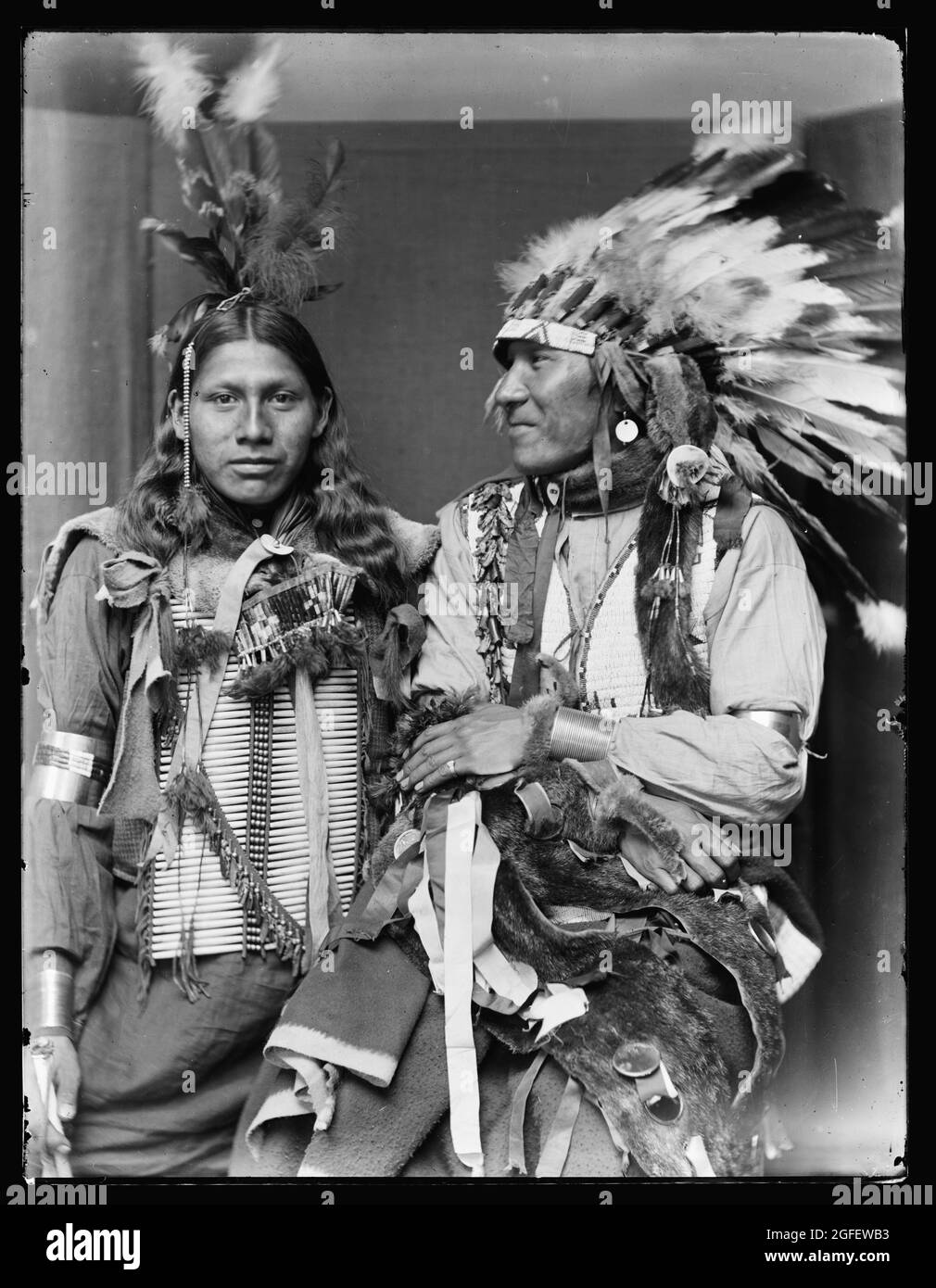 Holy Fro- left and Big Turnips, native americans / American Indians. probably members of Buffalo Bill's Wild West Show. C 1900. Stock Photo