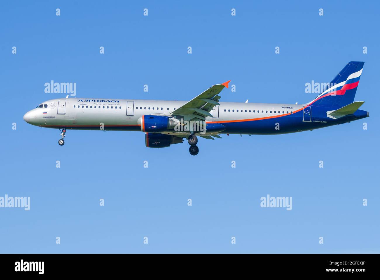 SAINT PETERSBURG, RUSSIA - AUGUST 08, 2020: Airbus A321 'K. Tsiolkovsky' (VQ-BEG) Aeroflot - Russian Airlines on a glide path in a cloudless blue sky. Stock Photo