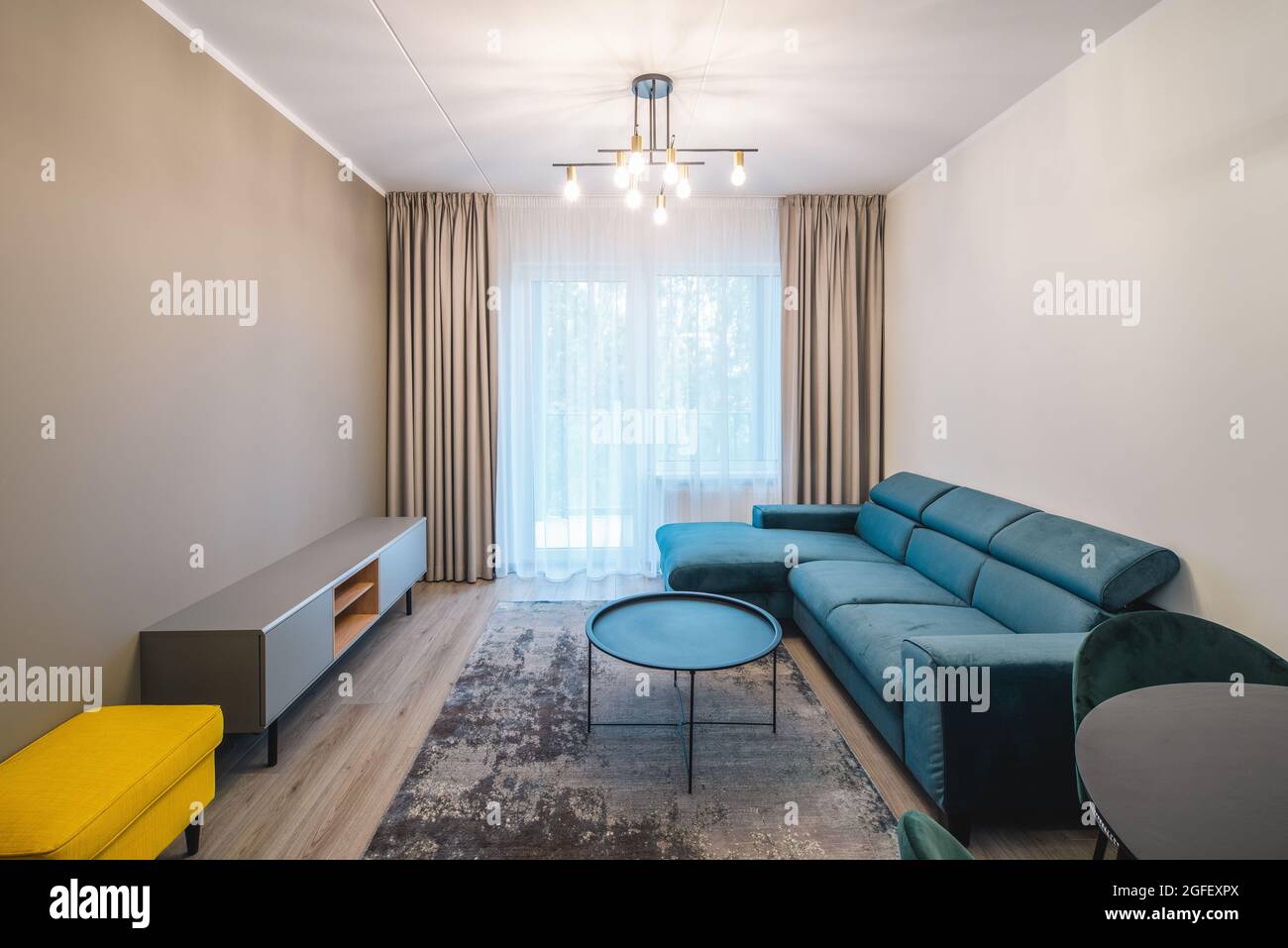 Image showcasing Contemporary interior of renovated living room with cozy furniture in ...