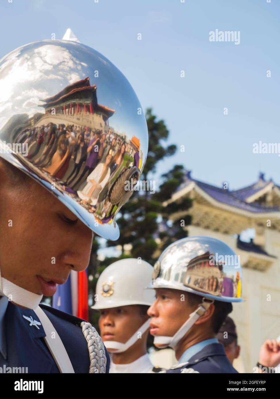 2 Taipei, Taiwan - October 02, 2016: Soldier wearing shining helmet with a  reflection of the building National Theatre on it Stock Photo