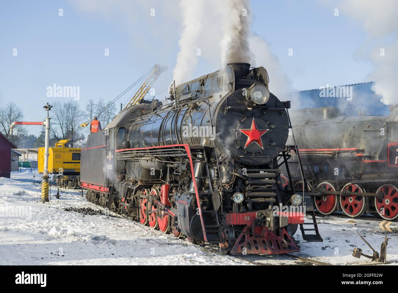 SORTAVALA, RUSSIA - MARCH 10, 2021: Old Soviet cargo steam locomotive of the 'LV' series at the Sortavala station on a frosty winter morning Stock Photo