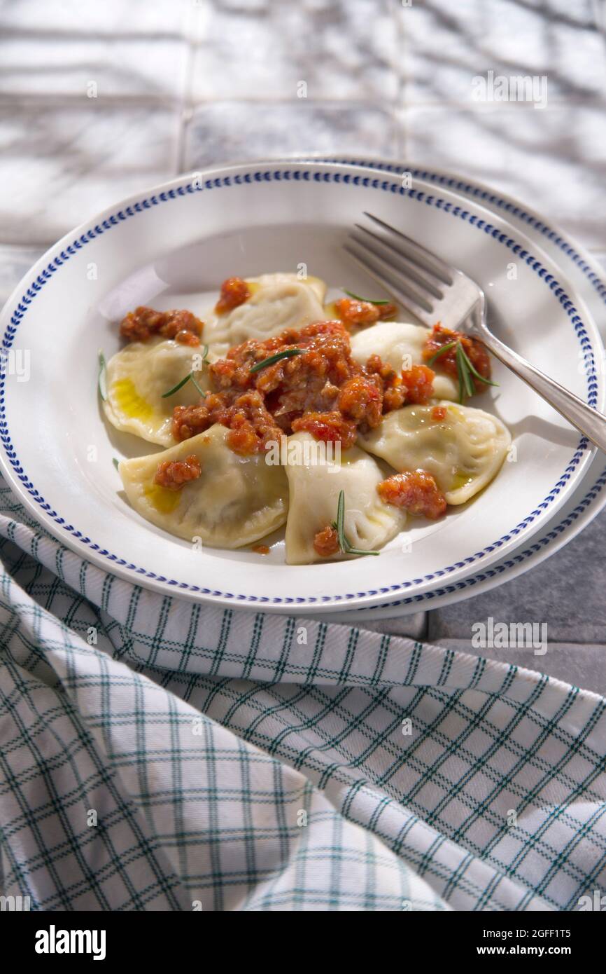 Presentation typical Tuscan dish, tortelli with meat sauce Stock Photo