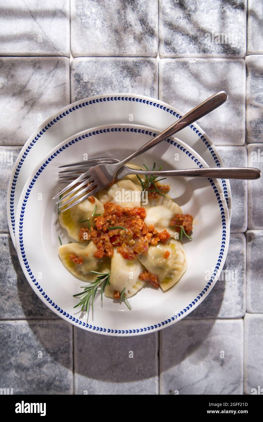 Presentation typical Tuscan dish, tortelli with meat sauce Stock Photo