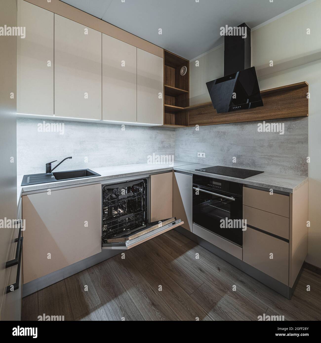 https://c8.alamy.com/comp/2GFF28Y/contemporary-interior-of-stylish-beige-kitchen-in-new-apartment-oven-and-sink-empty-wooden-shelves-black-fan-2GFF28Y.jpg