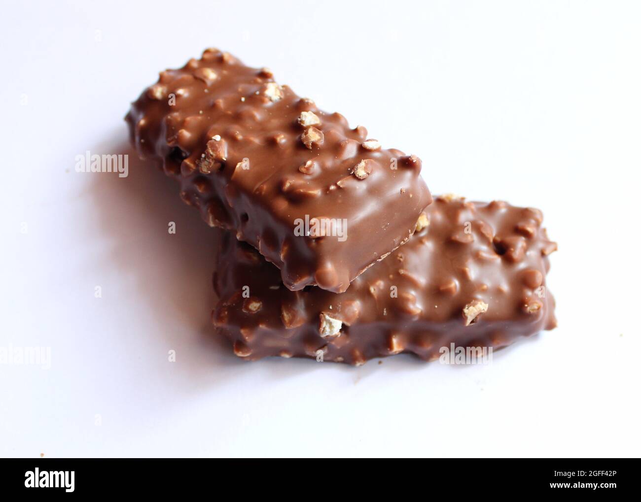 brown chocolate bar nuts one above the other Stock Photo Alamy
