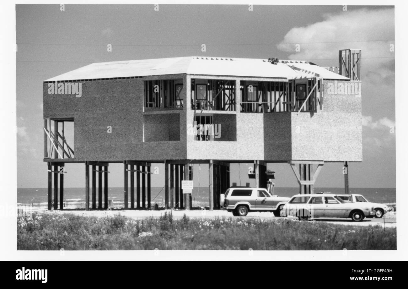 Galveston Texas USA, 1994: Beach home, raised on pilings to put it above hurricane storm surges, under construction near Gulf of Mexico.  ©Bob Daemmrich Stock Photo