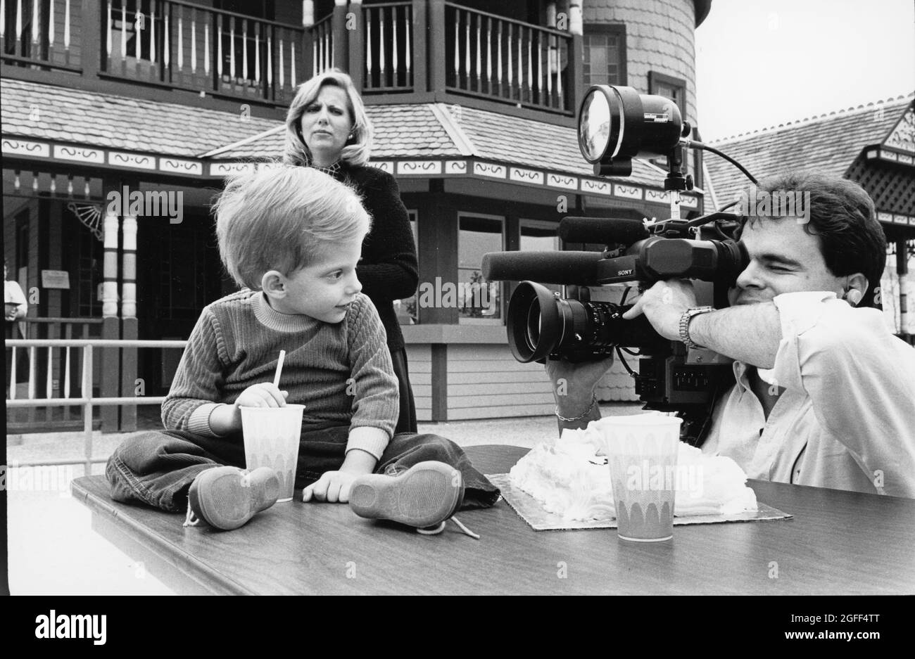 Austin Texas USA, circa 1991: Handicapped poster child for local charity poses for TV news cameraman at press conference.  ©Bob Daemmrich Stock Photo