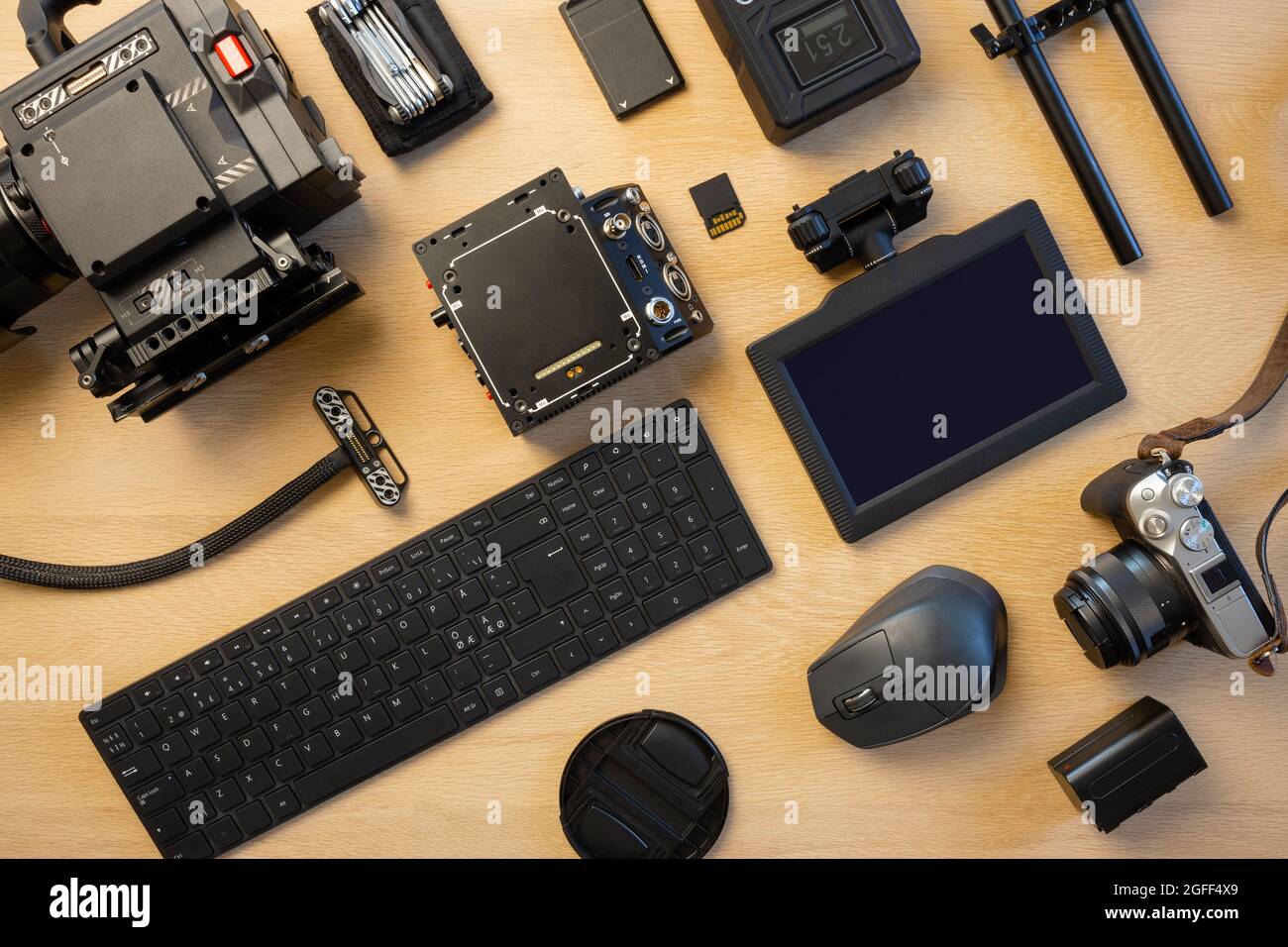 Flat lay of filming equipment with computer parts on table Stock Photo