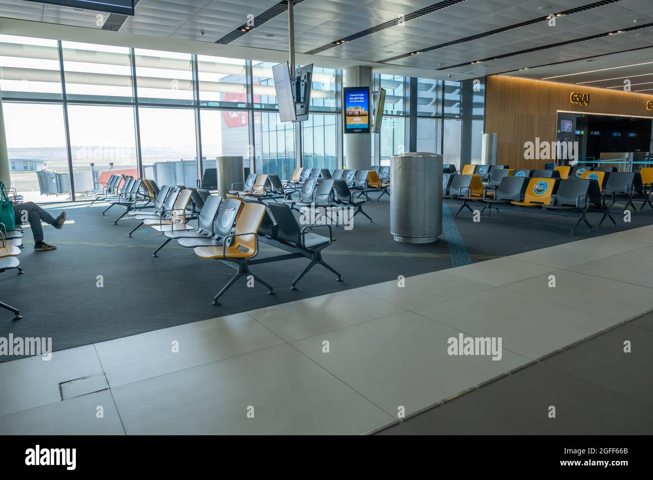 Arnavutkoy, Istanbul, Turkey - 03.08.2021: a lot of empty chairs and seats and shops in Istanbul Airport in quarantine days Stock Photo