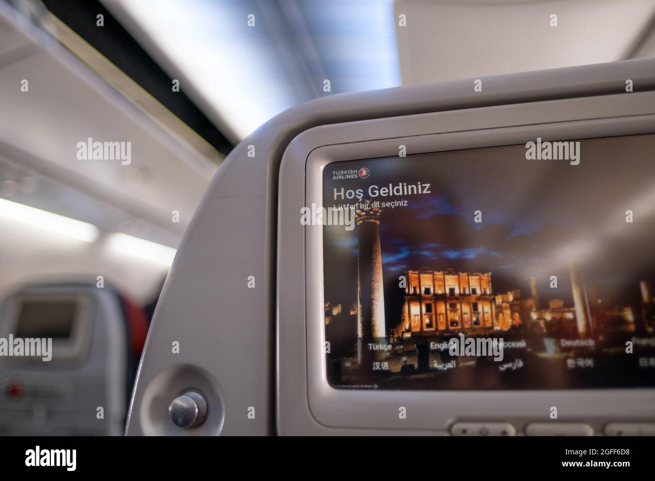 Arnavutkoy, Istanbul, Turkey - 03.08.2021: screen on back of seats of Turkish Airlines airplane. Translation: Welcome, please choose a language Stock Photo