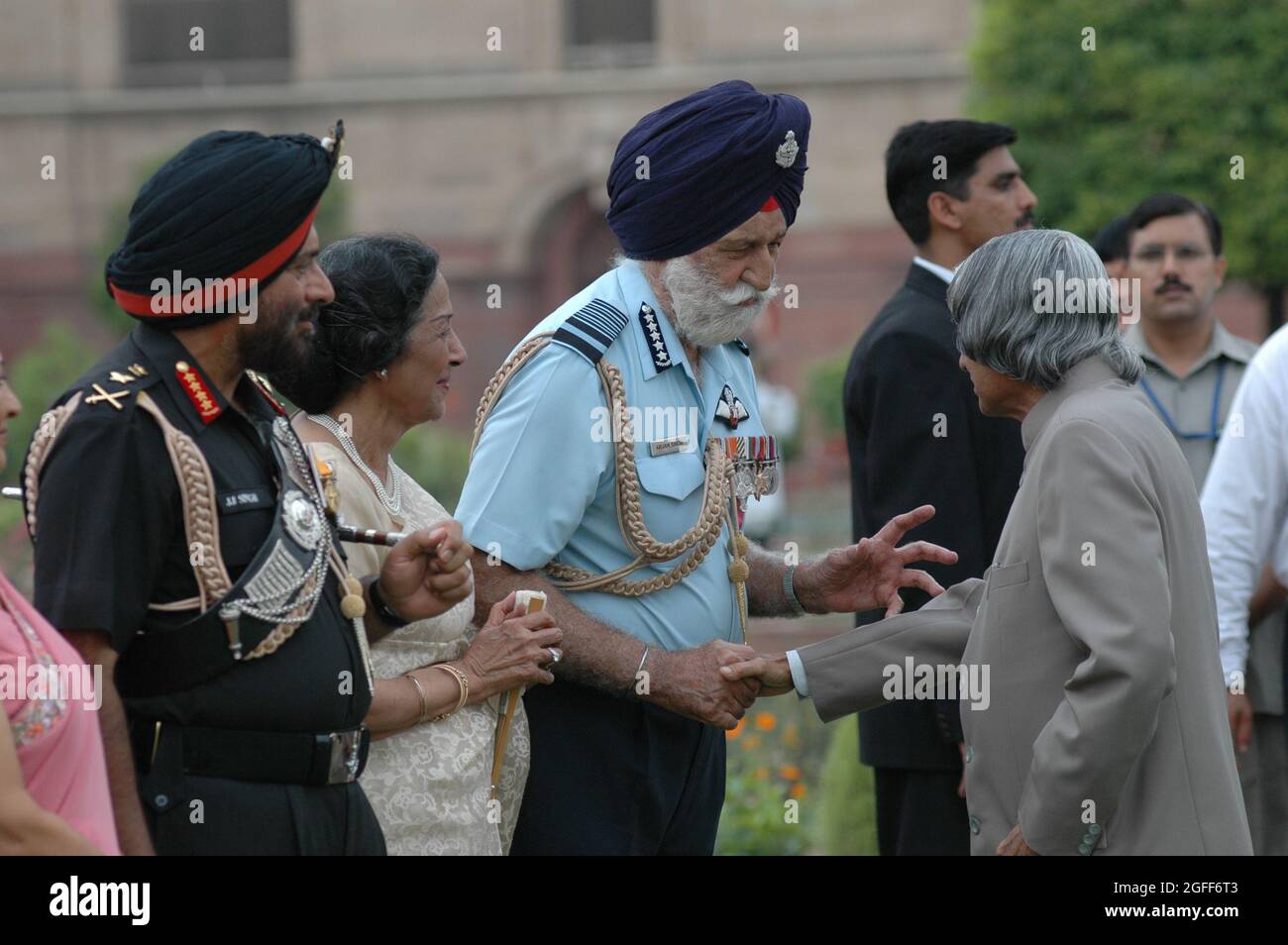 President A.P.J. Abdul Kalam shake hands with Marshal of the Indian Air Force Arjan Singh as the Chief of Army General J.J. Singh looks on. Photo by S Stock Photo