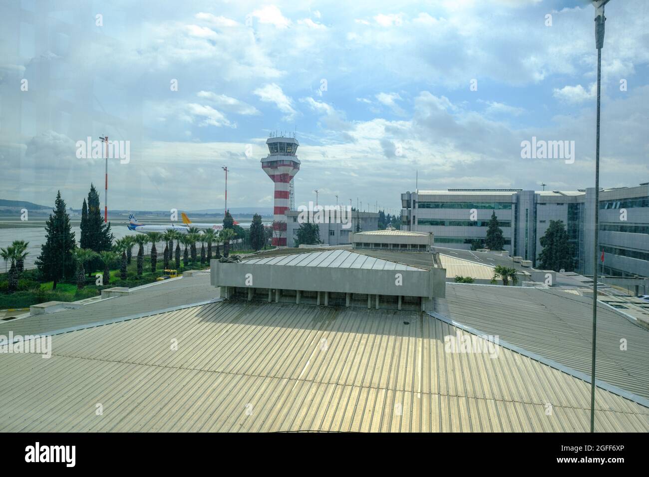 Gaziemir, Izmir, Turkey - 03.11.2021: air traffic control tower of Izmir Aydin Menderes Airport in a cloudy air Stock Photo