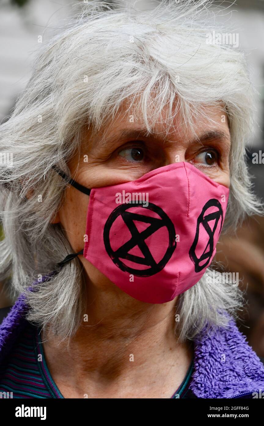 London, UK. August 25th 20201:  Protester wearing a XR face mask. Extinction Rebellion London Protests, Day Three. Embassy of Brazil, Cockspur Street, Westminster. Credit: michael melia/Alamy Live News Stock Photo