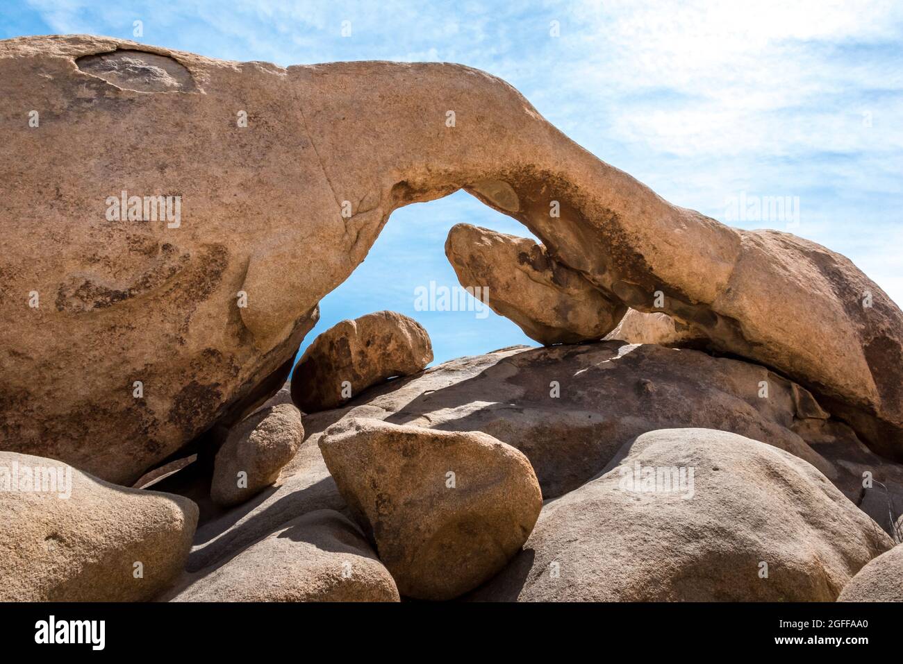 Arch Rock without tourists. This is one of the most popular easy hiking trails and most photographed landmarks in Joshua Tree National Park. Stock Photo