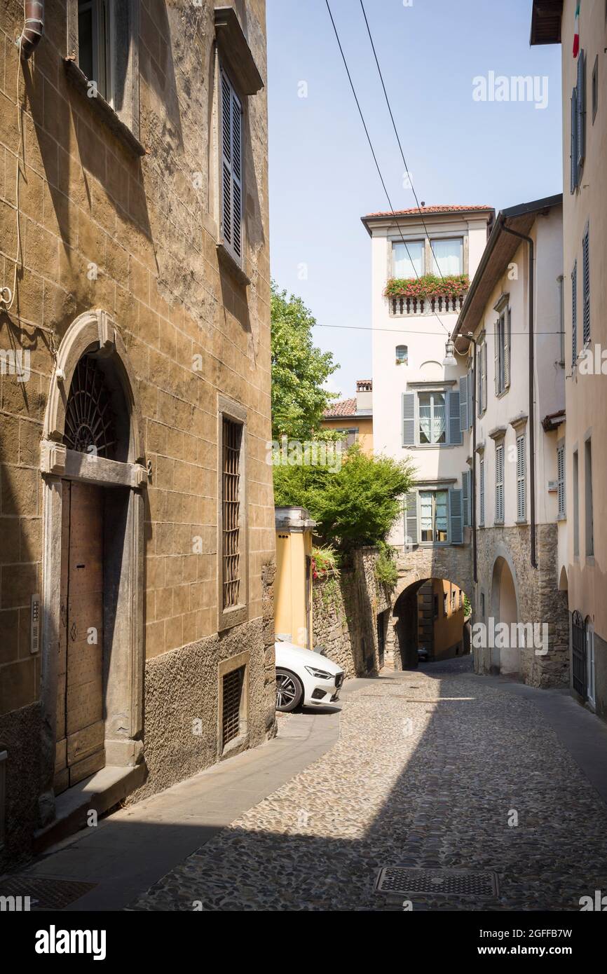Citta Alta, Bergamo, Italy: typical street scene; palazzos with shuttered windows; narrow, curving streets; glimpses of landmarks. Stock Photo