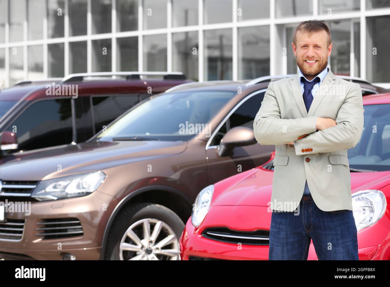 Car dealer on new cars background Stock Photo Alamy