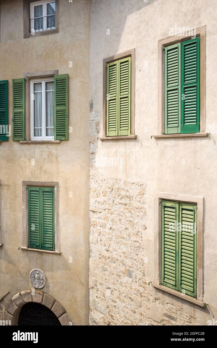 Citta Alta, Bergamo, Italy: typical street scene; tall palazzos with green shutters over windows on Piazza Rosate. Stock Photo