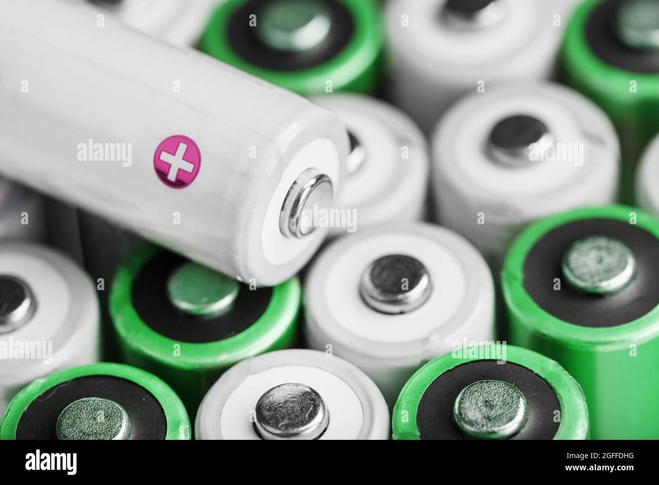 Rechargeable AA batteries with white and positive polarity. Selective focus Stock Photo