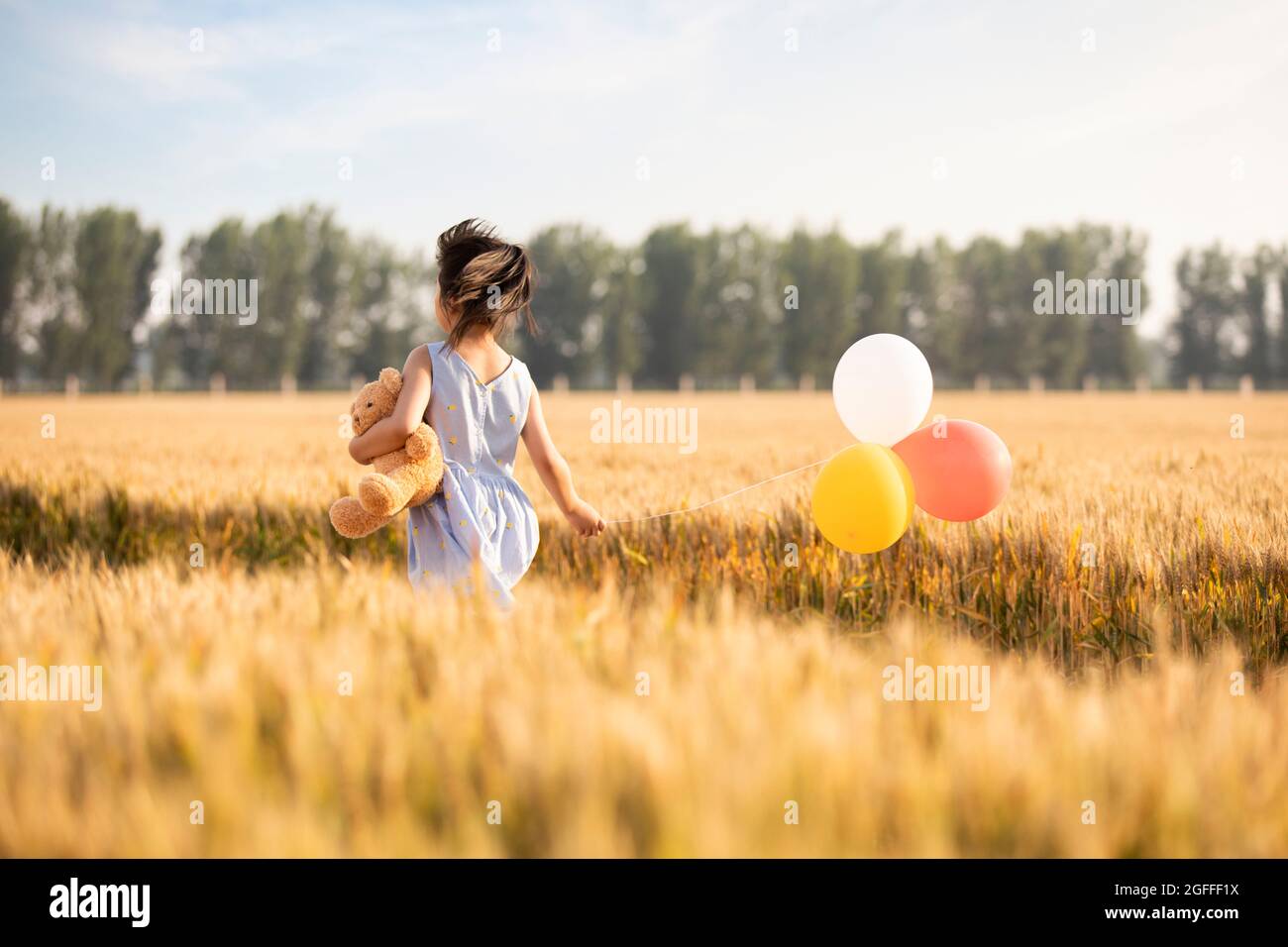 Rear view three little girls hi-res stock photography and images - Alamy