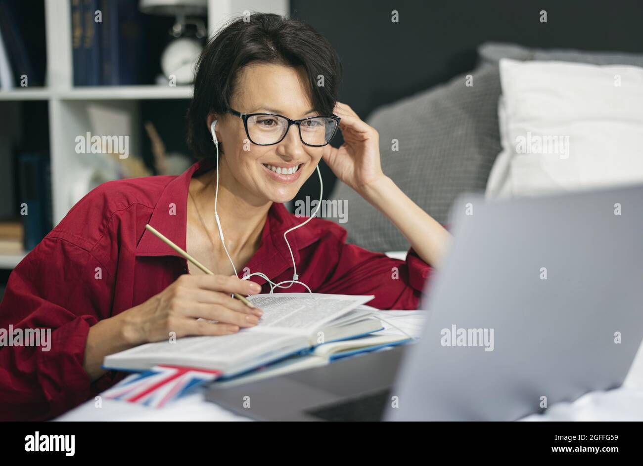 Woman using laptop for studying Stock Photo