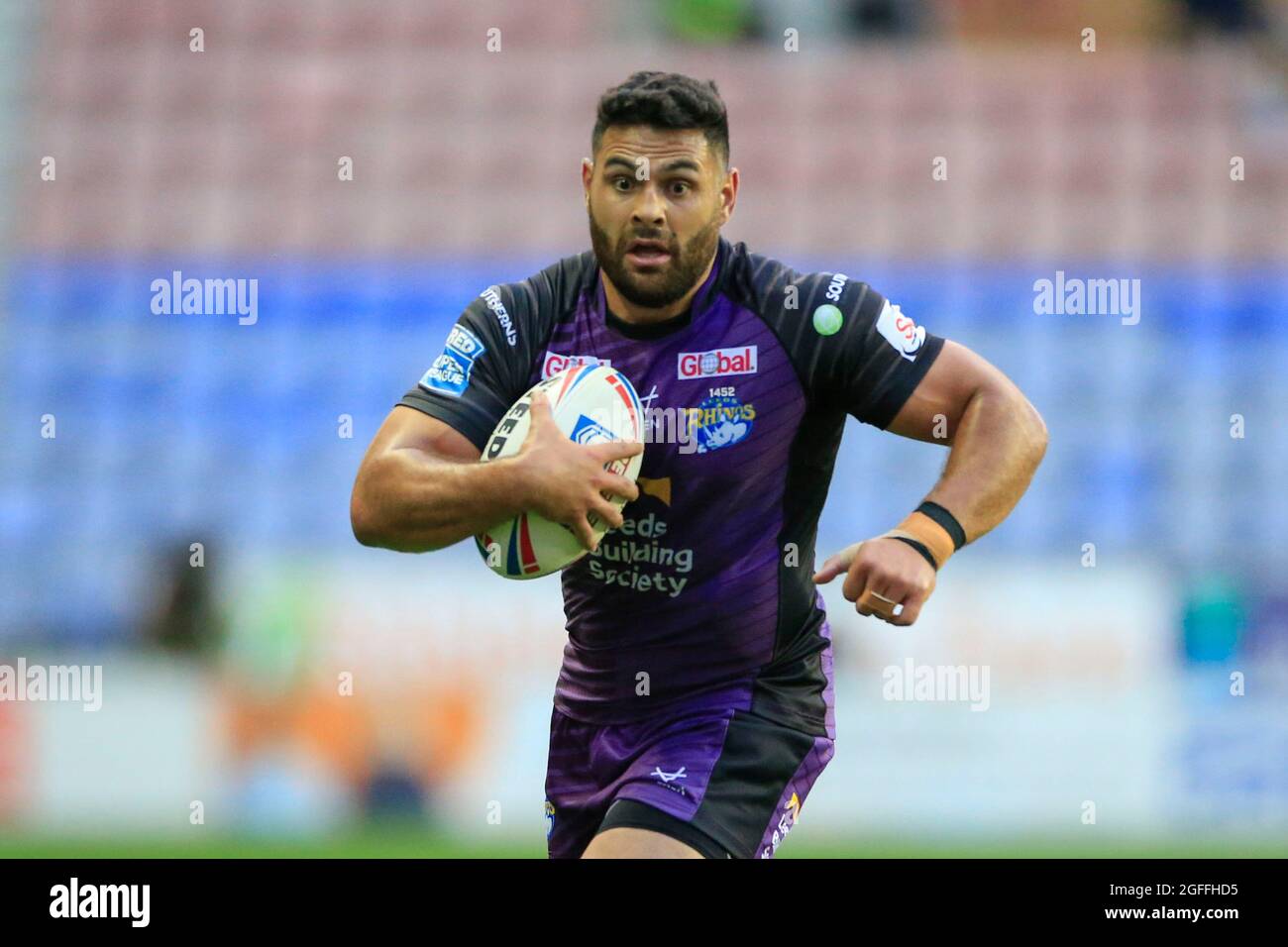 Wigan, UK. 25th Aug, 2021. Rhyse Martin (12) of Leeds Rhinos runs with the ball in Wigan, United Kingdom on 8/25/2021. (Photo by Conor Molloy/News Images/Sipa USA) Credit: Sipa USA/Alamy Live News Stock Photo