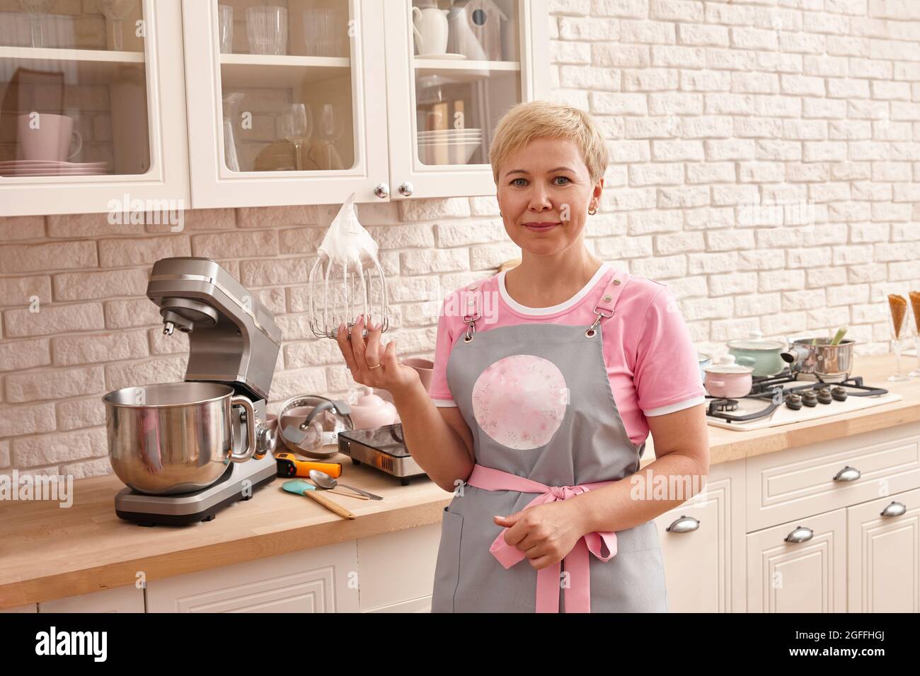 Woman confectioner making sweets in the kitchen Stock Photo