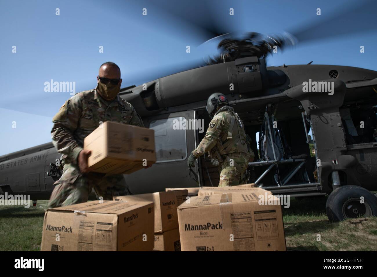 Anse Au Veau, Haiti. 24th Aug, 2021. U.S. Army Col. Samuel Agosto, assists with the unloading of food supplies during a humanitarian mission August 24, 2021 in Anse au Veau, Haiti. The military is assisting in the aftermath of the recent earthquake. Credit: Planetpix/Alamy Live News Stock Photo