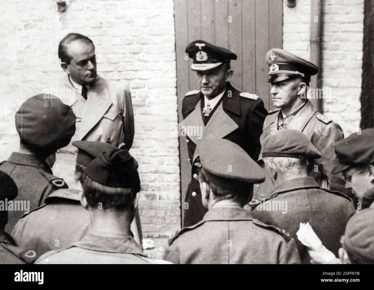 Allied war correspondents interview, left to right: Albert Speer, Hitler’s Minister of Production; Grand Admiral Karl Donitz, Hitler’s successor, and Colonel General Alfred Jodl, acting Commander-in-Chief of the German Army, shortly after their arrest May 24, 1945, at Flonsburg, Germany. Stock Photo