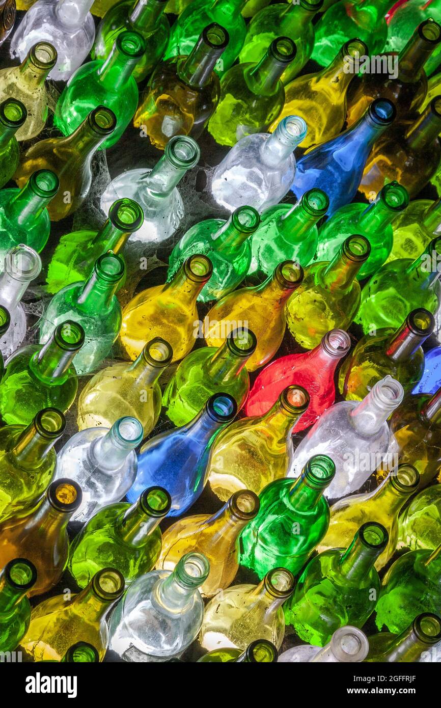 Empty coloured glass wine bottles Stock Photo