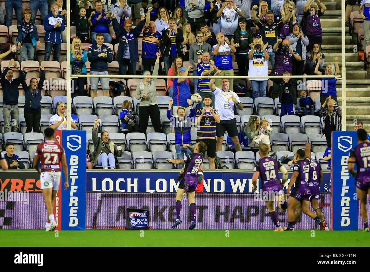 Wigan, UK. 25th Aug, 2021. Richie Myler (16) of Leeds Rhinos celebrates his try in front of the Leeds fans in Wigan, United Kingdom on 8/25/2021. (Photo by Conor Molloy/News Images/Sipa USA) Credit: Sipa USA/Alamy Live News Stock Photo