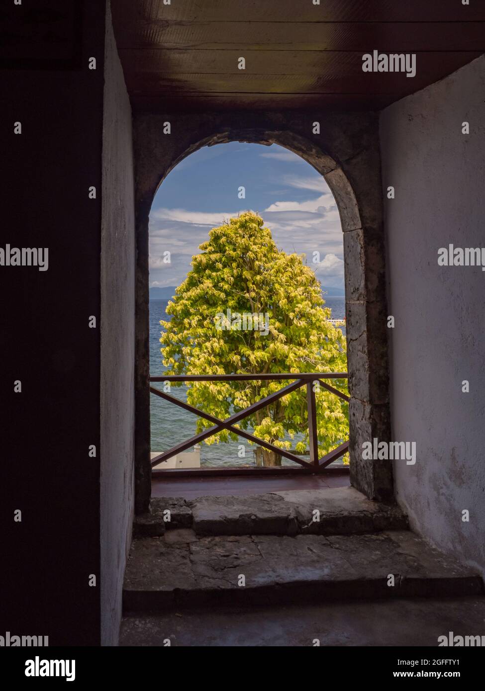 Ambon Island, Indonesia - Feb 2018: View from inside to the ocean through the window of Fort Amsterdam is a fort and bunker in the city of Hila, Leihi Stock Photo