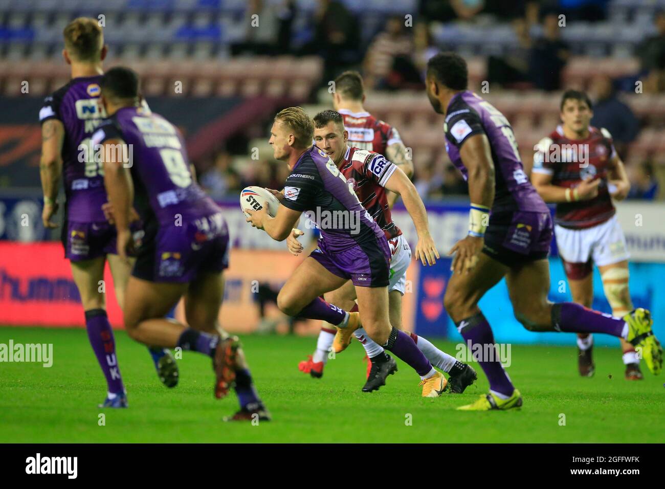 Wigan, UK. 25th Aug, 2021. Brad Dwyer (14) of Leeds Rhinos runs with the ball in Wigan, United Kingdom on 8/25/2021. (Photo by Conor Molloy/News Images/Sipa USA) Credit: Sipa USA/Alamy Live News Stock Photo