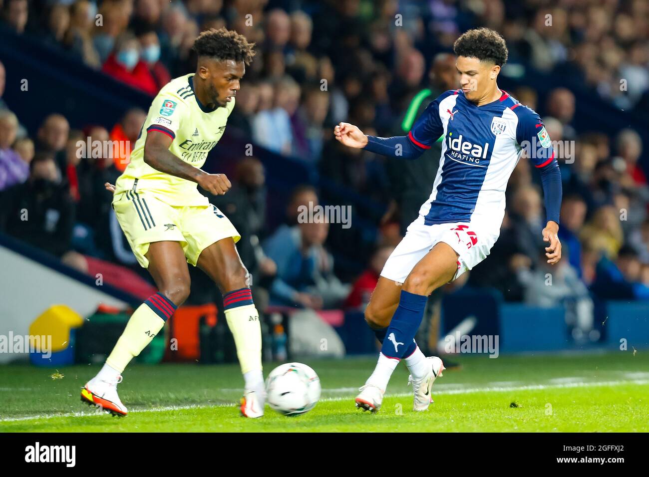 West Bromwich, West Midlands, UK. 25th August 2021; The Hawthorns, West Bromwich, West Midlands, England; EFL Cup Football, West Bromwich Albion versus Arsenal; Ethan Ingram of West Bromwich Albion moves in to tackle Nuno Tavares of Arsenal Credit: Action Plus Sports Images/Alamy Live News Stock Photo