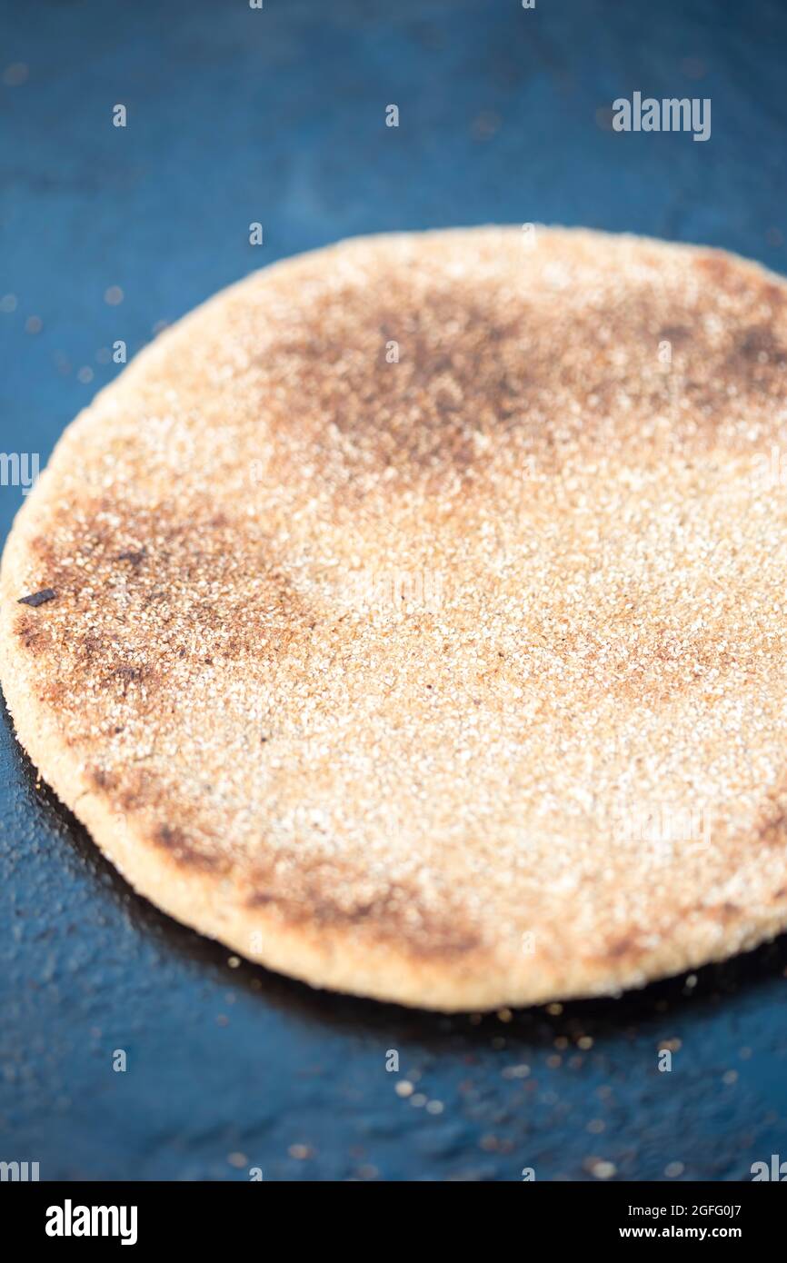 Moroccan whole wheat flatbread on grill pan Stock Photo