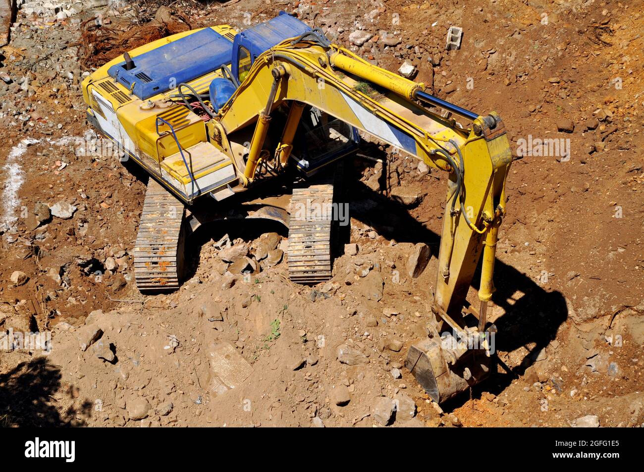 Excavator continues to work at the construction site, excavation site ...