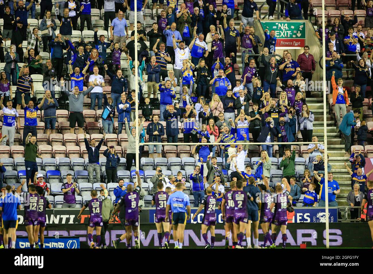Wigan, UK. 25th Aug, 2021. Leeds players and fans celebrate the victory at the end of the game in Wigan, United Kingdom on 8/25/2021. (Photo by Conor Molloy/News Images/Sipa USA) Credit: Sipa USA/Alamy Live News Stock Photo