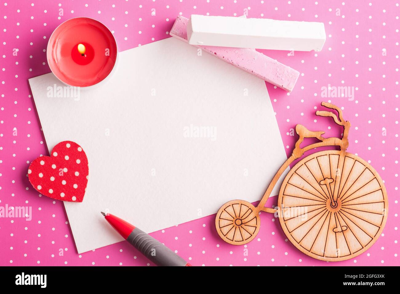 Blank card on pink polka dot background with bike, candle and chalk. Baby  girl shower party invitation. Toned image Stock Photo - Alamy