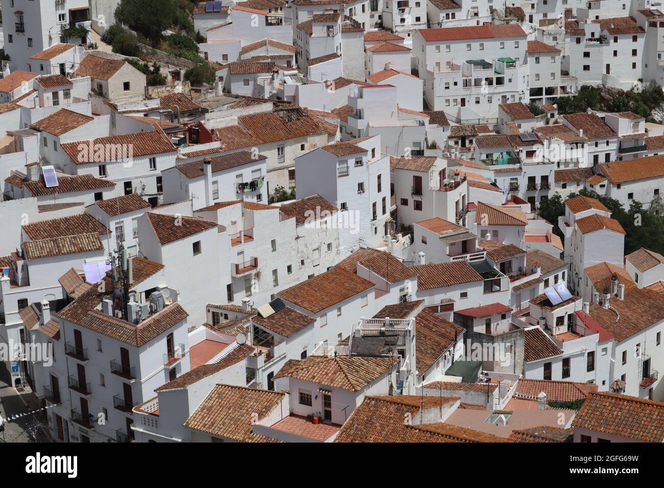 White Spanish village of Casares (Malaga) full of white-washed houses, narrow, steep and winding streets Stock Photo