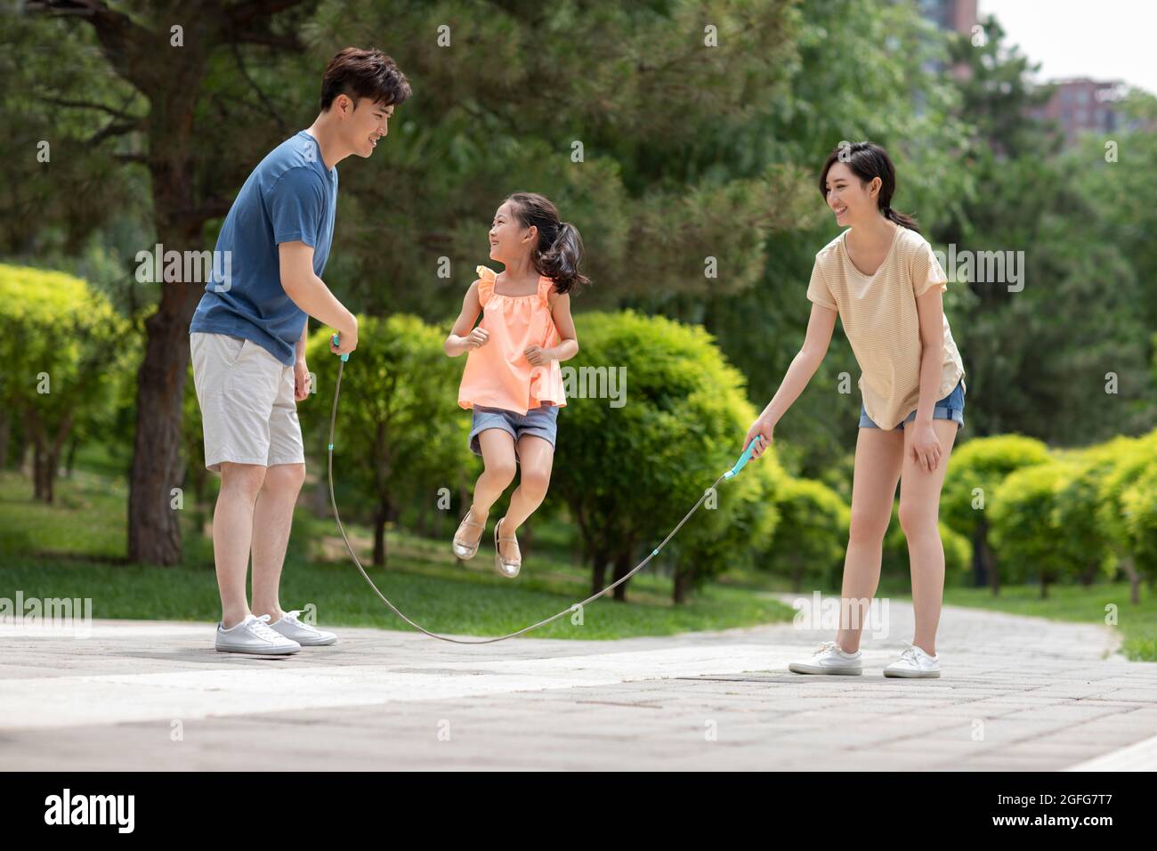 Daughter jumping rope mother hi-res stock photography and images - Alamy
