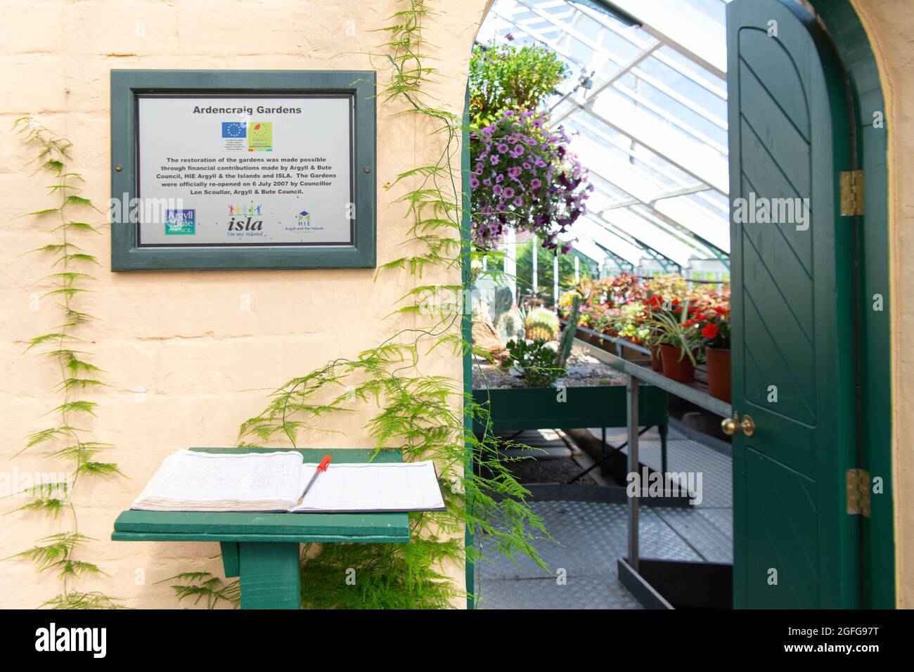 Ardencraig Gardens - visitor book at the entrance to one of the greenhouses - Rothesay, Isle of Bute, Argyll and Bute, Scotland, UK Stock Photo