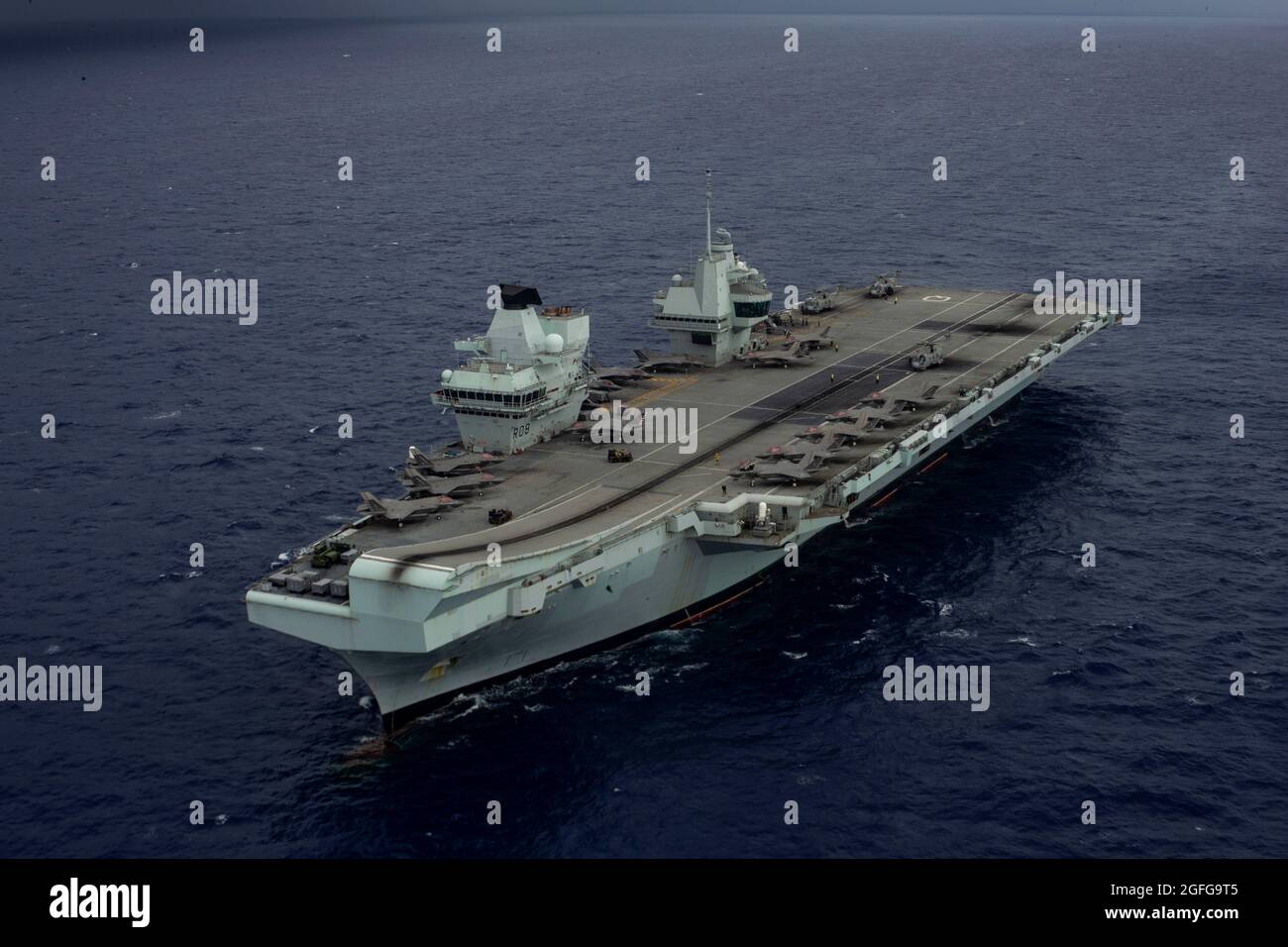 The HMS Queen Elizabeth sails in the Philippine Sea, August 21, 2021. The 31st MEU is operating aboard ships of the America Expeditionary Strike Group in the 7th fleet area of operations to enhance interoperability with allies and partners and serve as a ready response force to defend peace and stability in the Indo-Pacific region. (U.S. Marine Corps photo by Cpl. Alexandria Nowell) Stock Photo