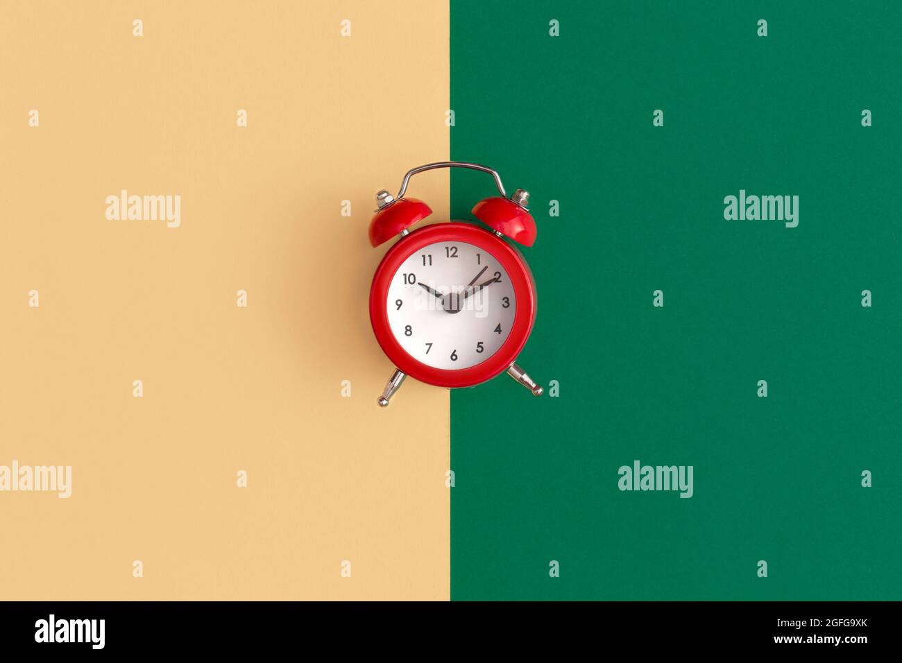Red alarm clock on color background Stock Photo