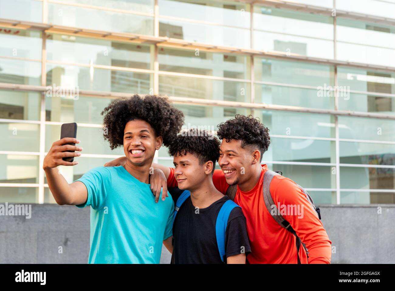 Multiethnic friends taking selfie in the street Stock Photo