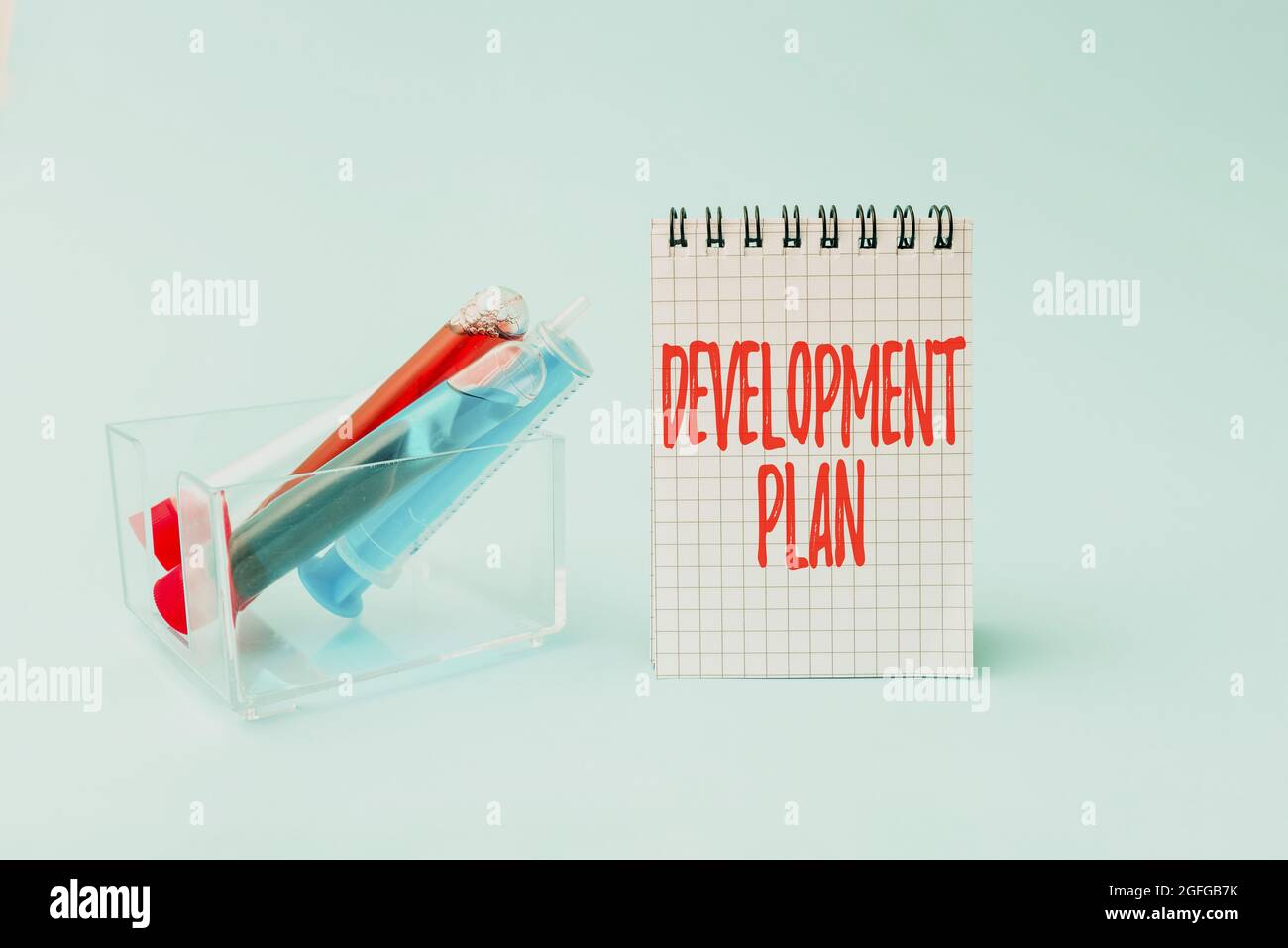 Hand writing sign Development Plan. Word Written on the planning of the ...
