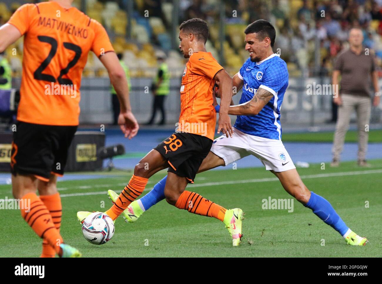 KYIV, UKRAINE - AUGUST 10, 2021: Pedrinho of Shakhtar Donetsk (L) fights for a ball with Daniel Munoz of Genk during their UEFA Champions League third qualifying round game in Kyiv. Shakhtar won 2-1 Stock Photo