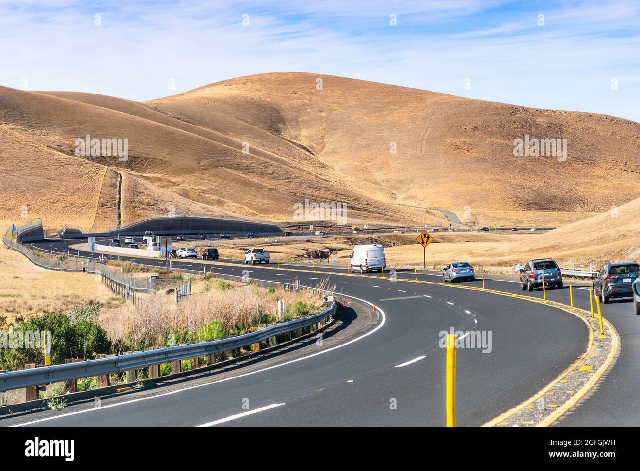 Busy traffic on the winding roads going through the golden hills of Contra Costa County, East San Francisco Bay Area, California Stock Photo