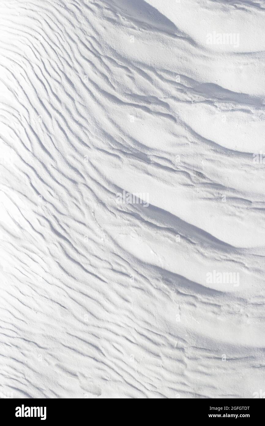Textured effect of waves on surface of gray and white stone. Pamukkale travertine surface in Turkey. Stock Photo